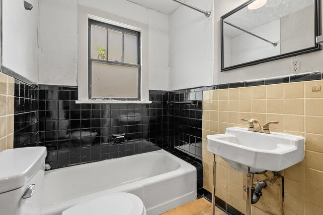 Building Photo - Charming 2BR/1BA Brick Cottage — Hardwoods, Fenced Yard, W/D Included