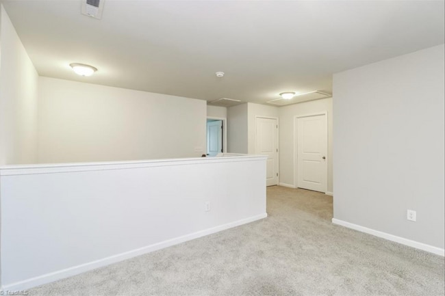 Building Photo - Impeccable maintenance-free 2 level 4 bedroom and 2.5 bath townhome in Greensboro