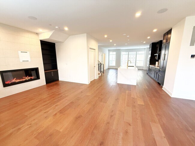 Building Photo - Brand new 4 level, 4 Bedroom Townhome with Elevator!