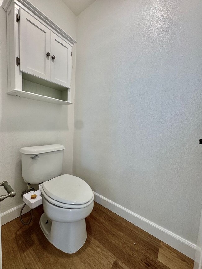 Building Photo - Beautifully Remodel Townhouse with AC & Two Car Garage!