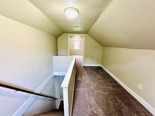 Building Photo - Updated two story home with unfinished bas...