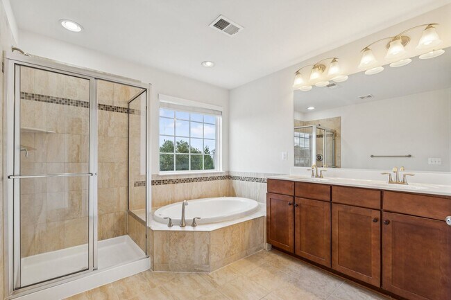 Building Photo - This beautifully maintained end-unit brick...