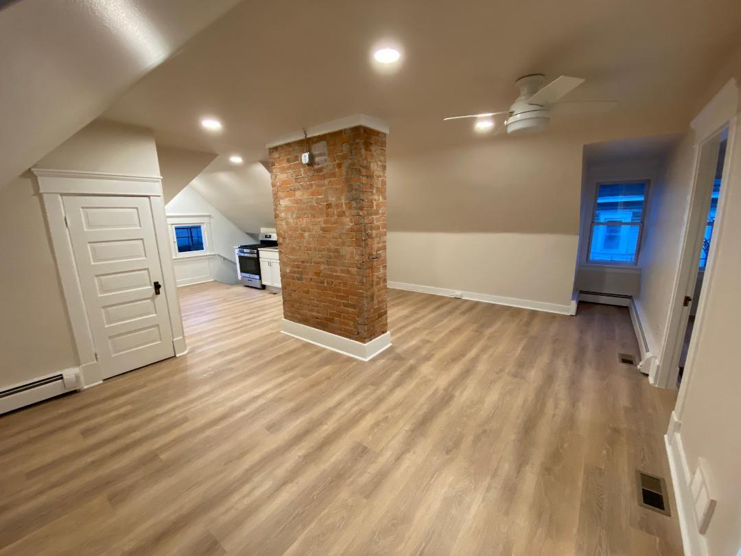 Large living - dining room with ceiling fan - 769 Delta Ave