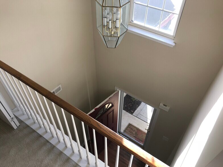 LANDING LOOKING DOWN TO ENTRYWAY - 2808 Cougar Hill Ct