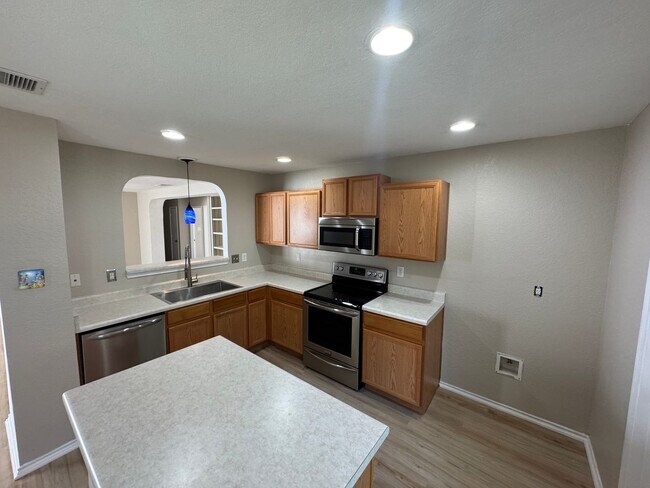 Building Photo - NEW PAINT, FLOORING, APPLIANCES & ROOF  | ...