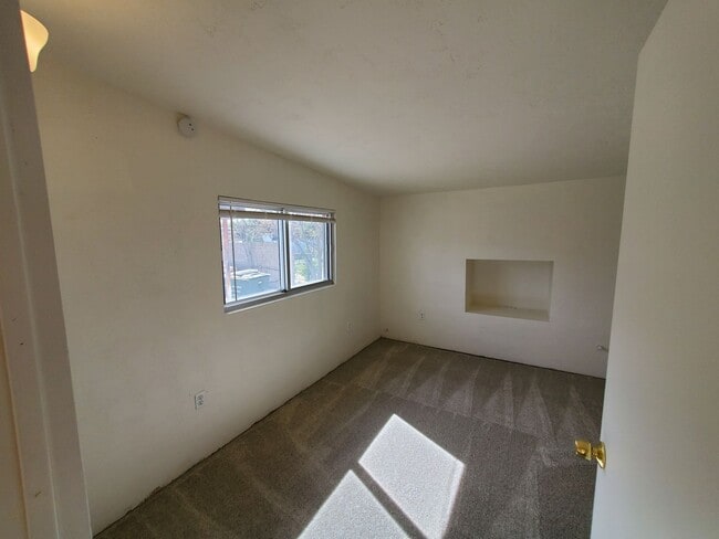 Building Photo - 4 bedrooms and 2 bathrooms with A/C.