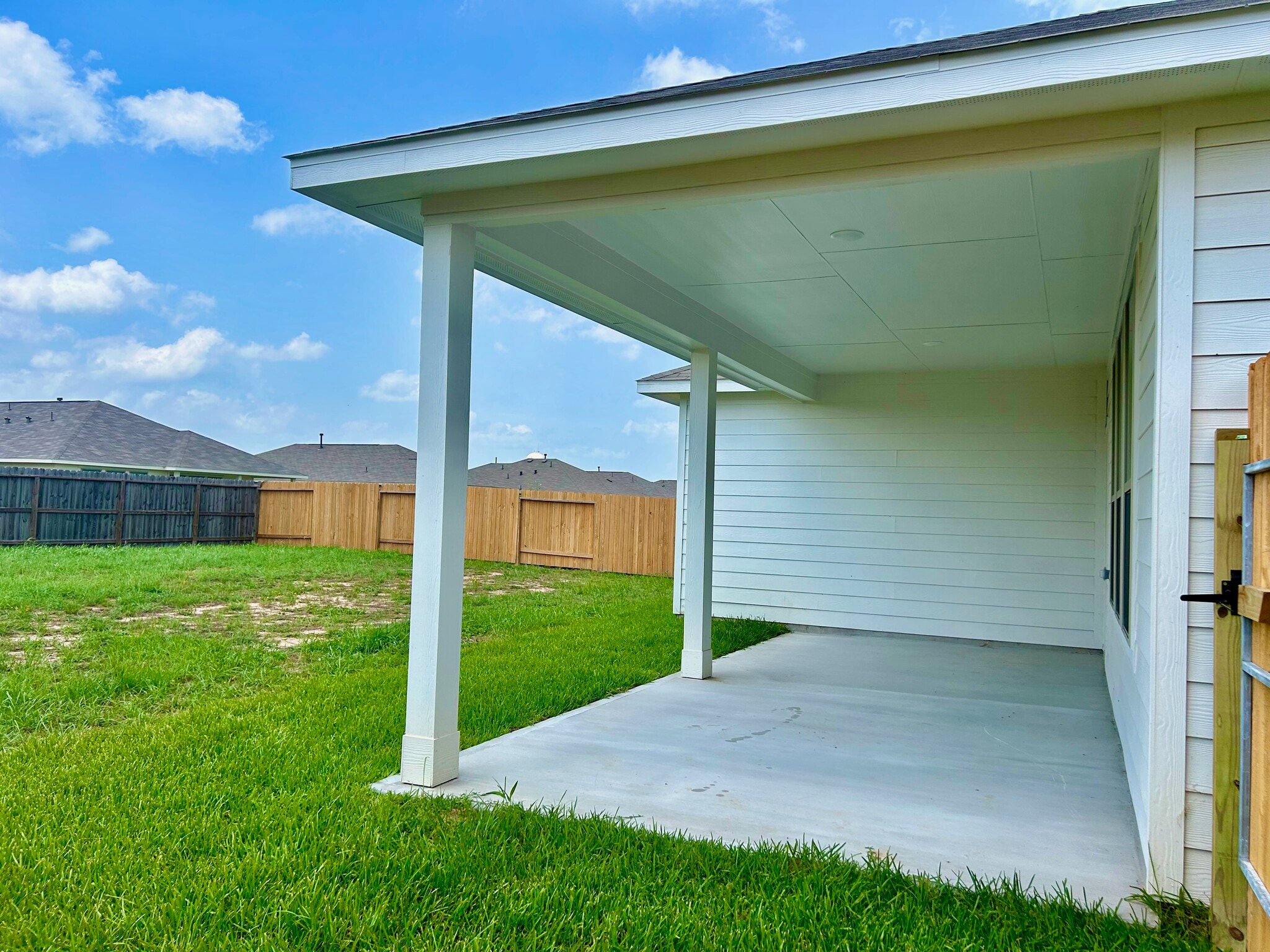 Enjoy relaxing with friends or watching your little ones play from your oversized covered patio! - 509 Turtle Dove Dr
