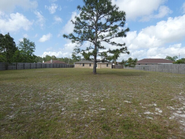 Building Photo - Spacious 3-Bedroom Home - Half Acre Lot
