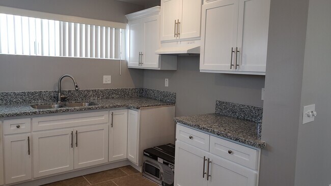 Building Photo - 2057 W Florence Ave