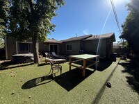 Building Photo - 7BD/4BA w/ Driveway Parking and Backyard!