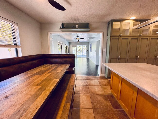 Building Photo - Elegant and Updated 3/2 Pool Home just min...