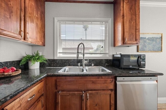 Building Photo - Welcome to this stunning 4-bedroom, 2-bath...