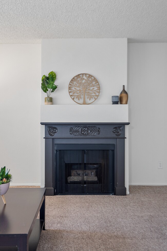 A fireplace in an apartment living room at the Diplomat - The Diplomat