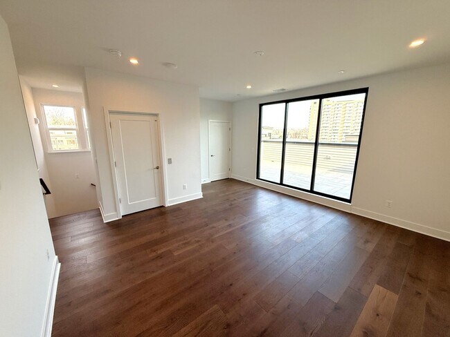 Building Photo - Brand new 4 level, 4 Bedroom Townhome with Elevator!