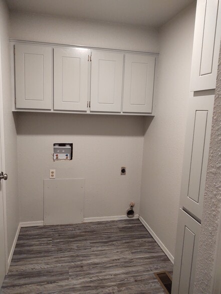 Utility Room. Washer/Dryer hookups and loads of storage! - 7126 NW 116th St