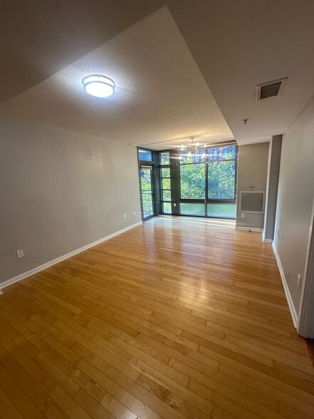 Living room view from kitchen. - 440 L St NW