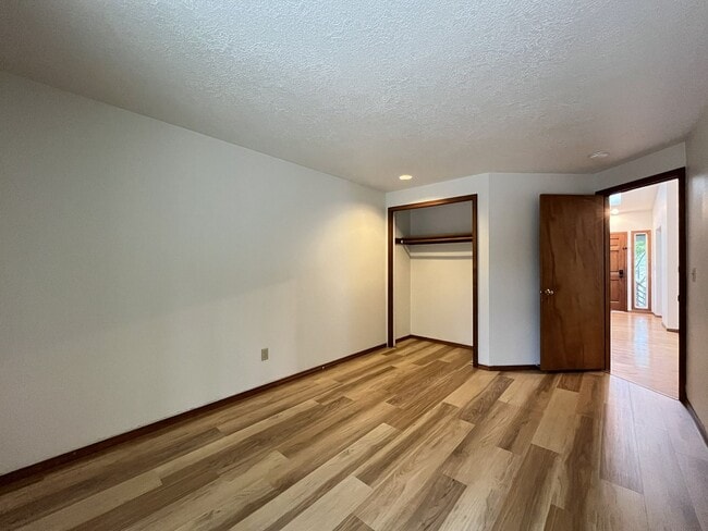 Building Photo - Spacious 3-Bedroom Home with Custom Stone Fireplace, Attached 2-Car Garage & Expansive Backyard i...
