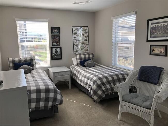 Building Photo - Four Bedroom Townhome with 2-car Garage Av...