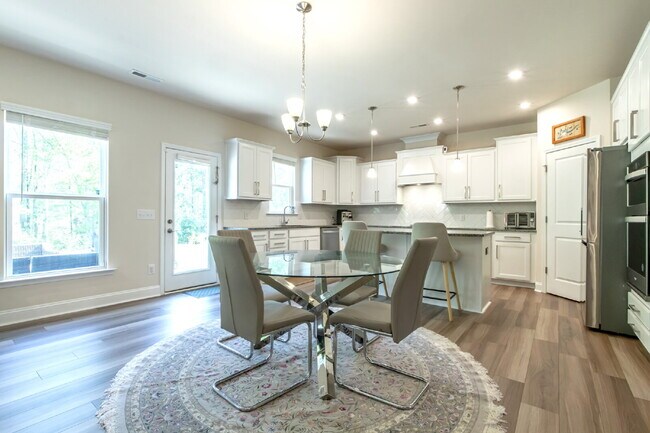 Building Photo - "Discover Spacious Living: 5-Bedroom Craftsman Home in Gated and Amenity-Rich Bretagne with Top-R...