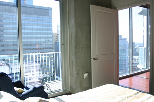 Sunny living space and bedroom and balcony - 210 N Church St