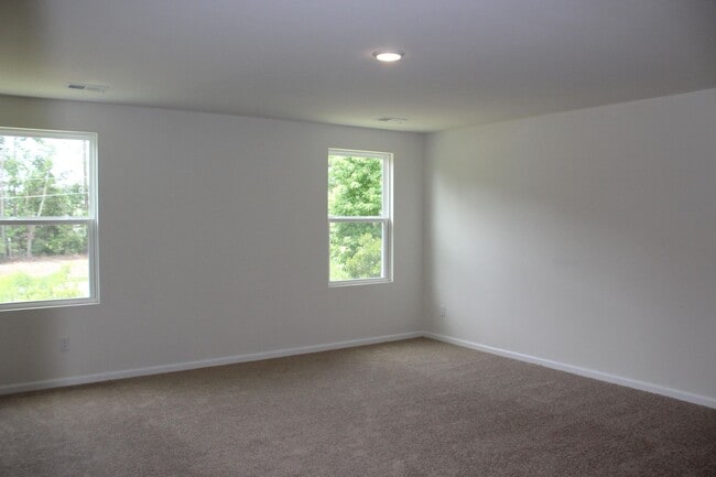 Building Photo - Sun-Filled 3-Story End-Unit Townhome with Fenced Yard, Storage & Resort-Style Pool