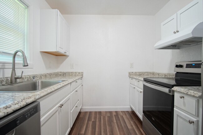 Building Photo - 4BR Home with LVP Flooring, Open Layout & Large Backyard Near Dogwood