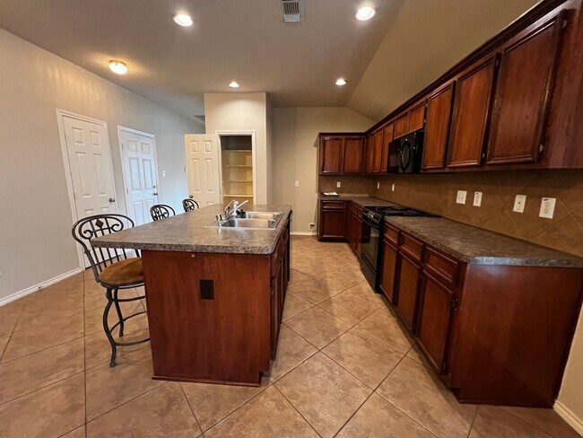 Building Photo - Charming 3-Bedroom Home with Modern Kitchen and Spacious Backyard