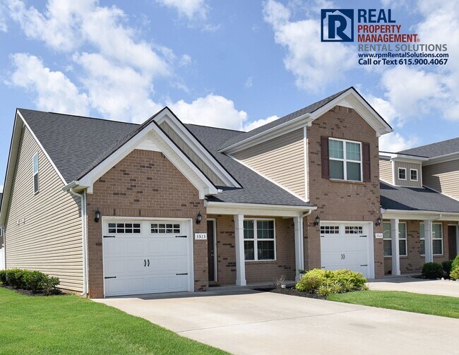 Building Photo - Gorgeous end unit 2 bedroom townhouse with garage! PLUS Loft!