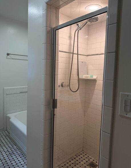 Separate shower and tub with beautiful subway tile - 9933 Robbins Dr