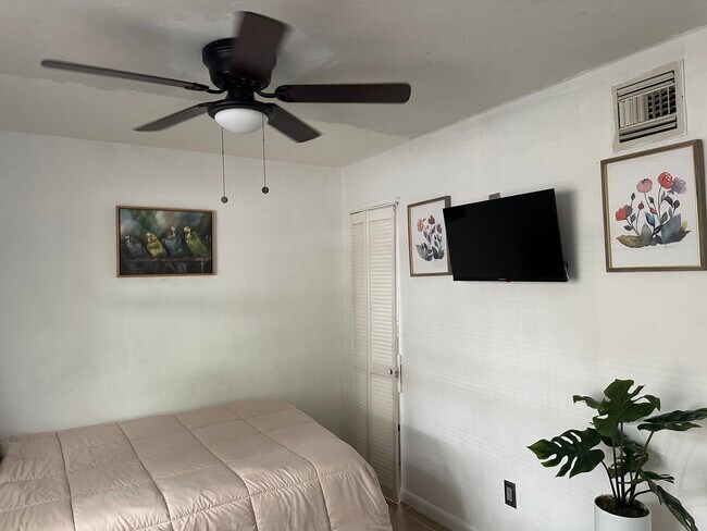 TV mounted on the wall with free limited movies and shows and nice wall pictures - 611 S Pine St