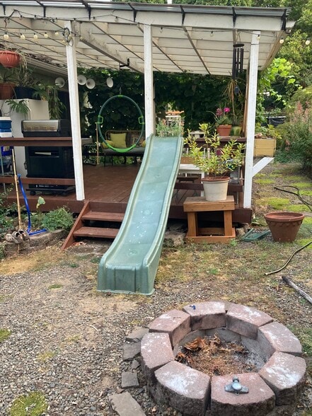 slide... right into the fire pit. Can you handle it? - 5055 NE 87th Ave