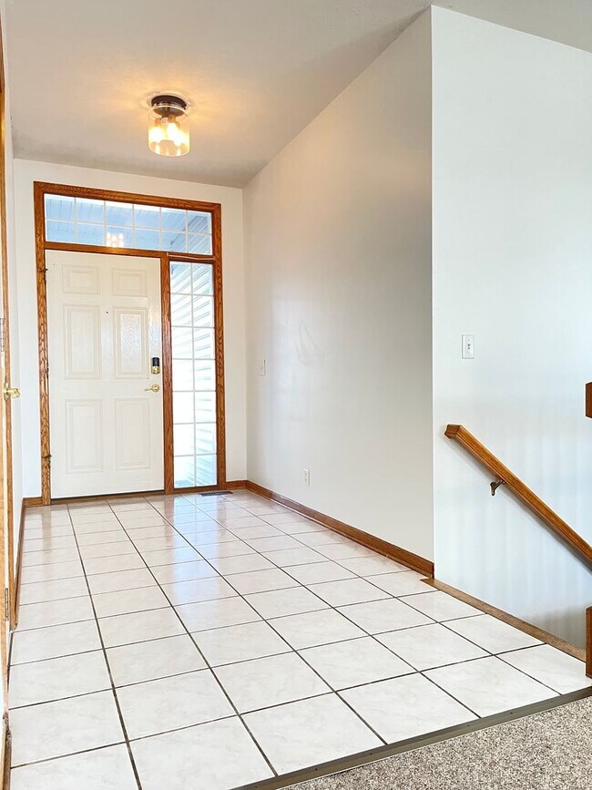 Building Photo - Northwest Omaha Gem: 2,700 Sq Ft, 3-Bedroom, Walk-Out Finished Basement, Fenced Yard, 3-Car Garag...