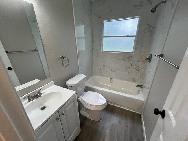 This bath has new tub, tile, toilet and vanity. - 2245 E Overton Rd