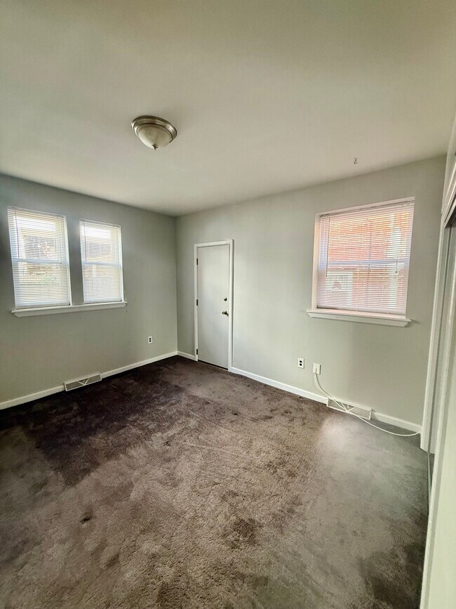 Bedroom has door to access small yard/patio in back of house. Yard is for first floor tenant only - 1217 Snyder Ave