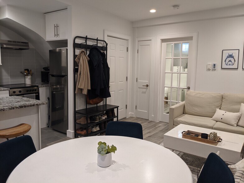 Front door leads into open living/kitchen area with bedroom on the left - 12 Melrose St