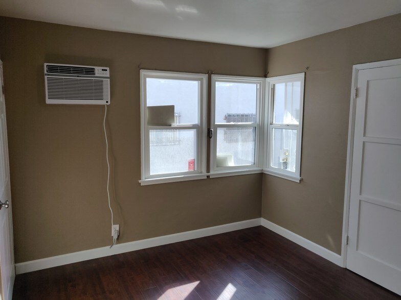 Bedroom south wall with new ac with remote - 6414 10th Ave