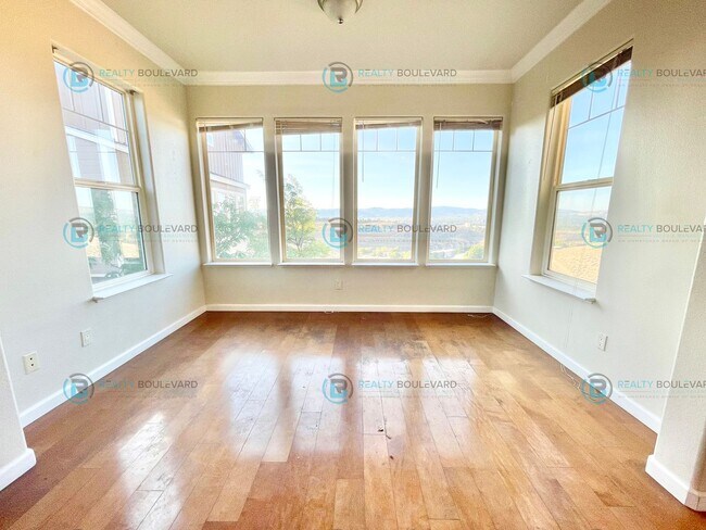 Building Photo - Stunning 3-Bedroom Townhome with Panoramic City Views, Upgraded Kitchen & Spacious Living in Nort...