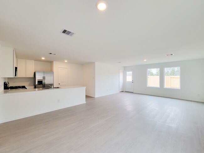 Building Photo - This great new single-story design makes smart use of the space available. At the front are all t...