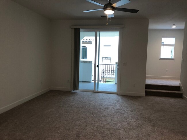 Building Photo - Tri-level Townhome with 2 Car Attached Gar...