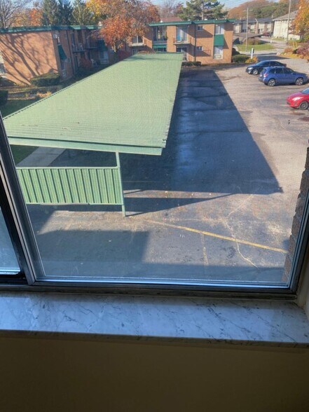 Carport view from Bedroom - 1860 Axtell Dr