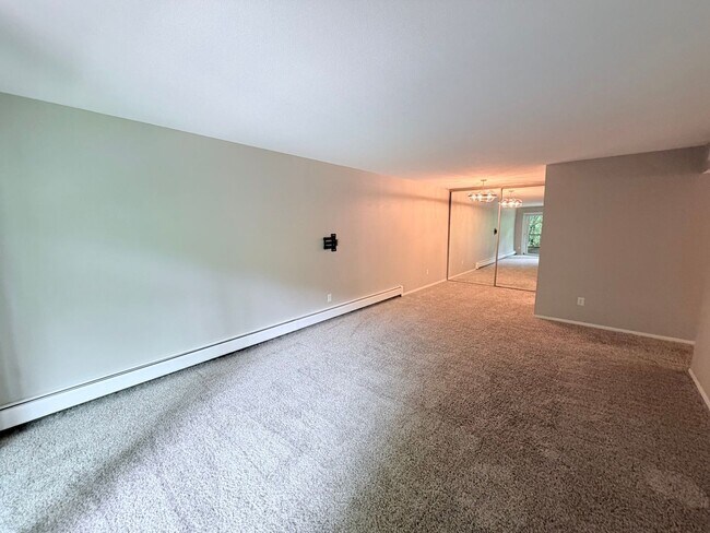 Building Photo - Large 1BR Condo with Patio, Heated Parking, Pool, Sauna & Tennis Courts!