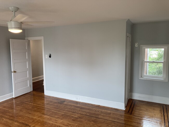 The front bedroom on the 2nd floor also enjoys excellent light and airflow thanks to three windows a - 2621 E Somerset St