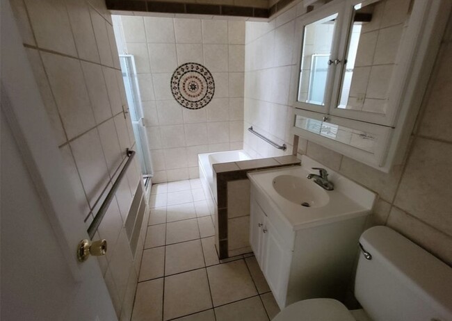 Main Floor Bathroom w/ tub and walk-in shower - 141 Lagrange St