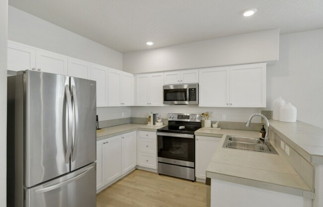 Building Photo - Modern Ground-Level Condo in River Terrace...