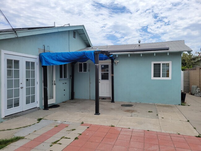 Back of the house- Left side is the laundry room - 11721 Puryear Ln