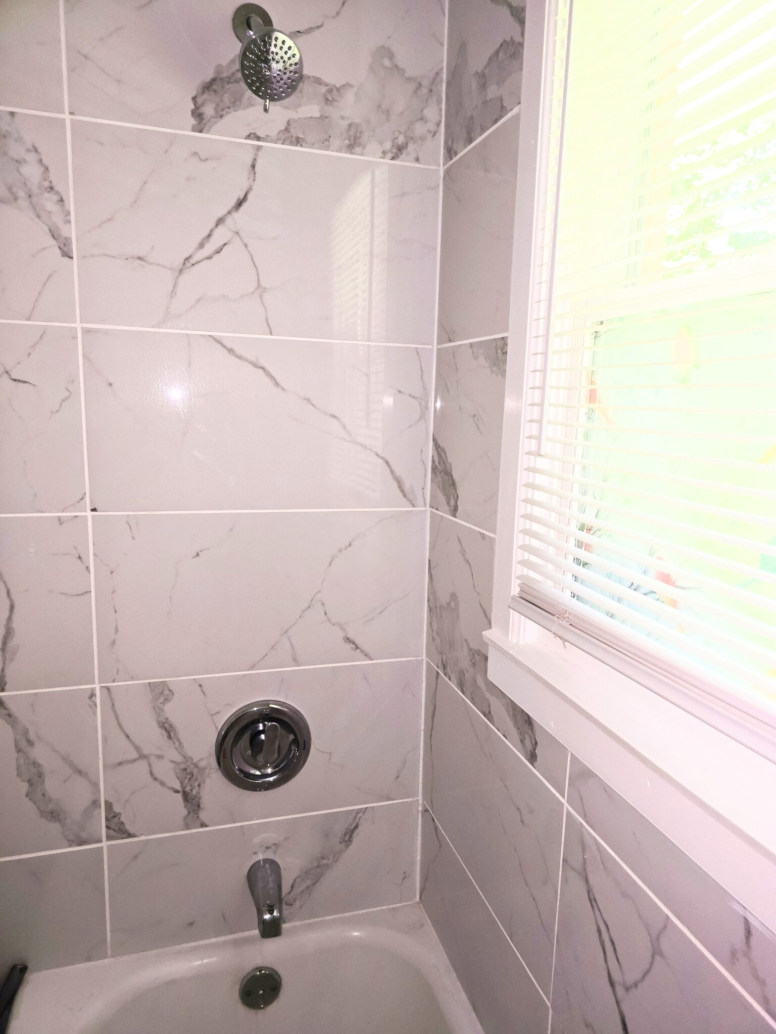 Tiled shower and new Moen fixtures. - 511 Reid St