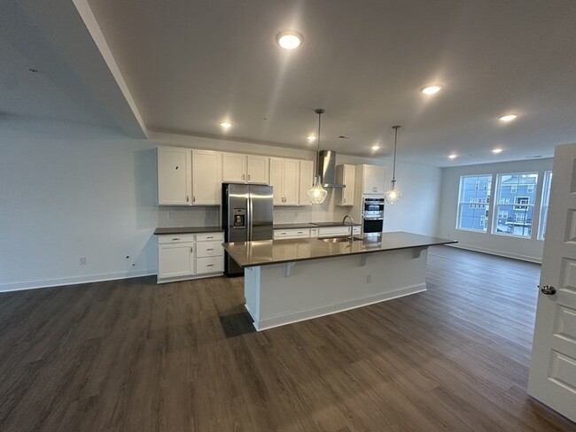 Building Photo - Brand New Condo Walking Distance to Wegman...