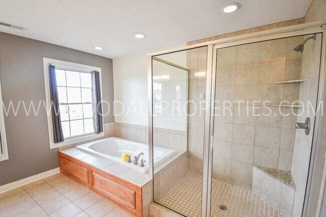 Building Photo - 4 Bedroom 4 Bath Executive Home in West Des Moines with a fenced in yard and a 3-car garage