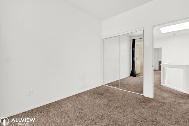 Building Photo - Spacious Coastal Condo with Rooftop Ocean ...