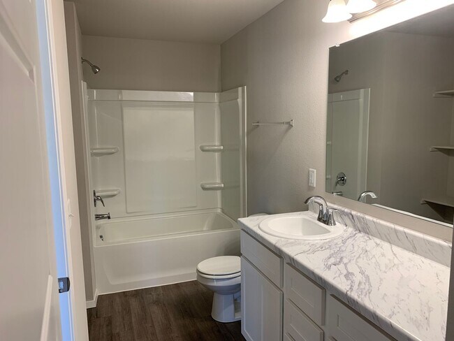 Building Photo - This well-designed 4-bedroom home has a split floor plan that gives the feeling of space.